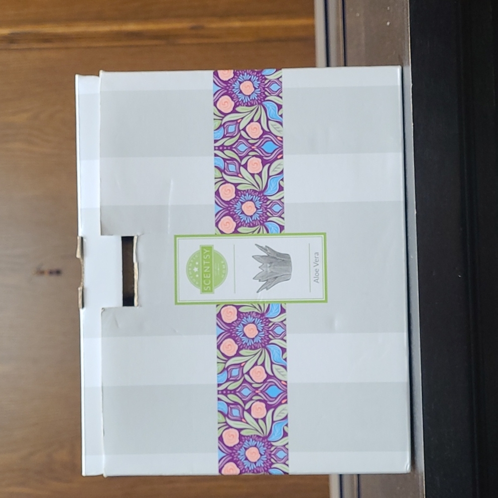 Brand new Scentsy brand warmer, waxes, and bath soak.